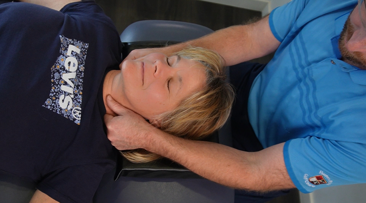 Osteopath performing neck treatment at The Health Space